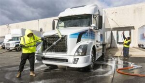Professional mobile fleet washing service cleaning semi-truck in houston
